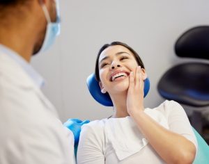 woman smiling in dentist chair